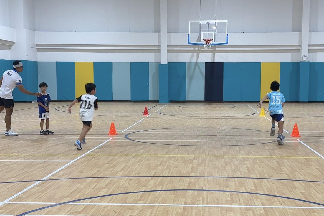 Children running a cone drill
