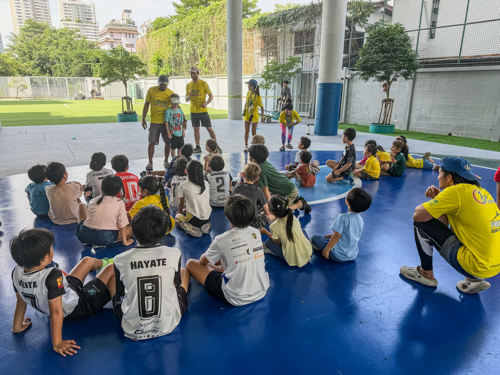 Children listening to the coaches' briefing