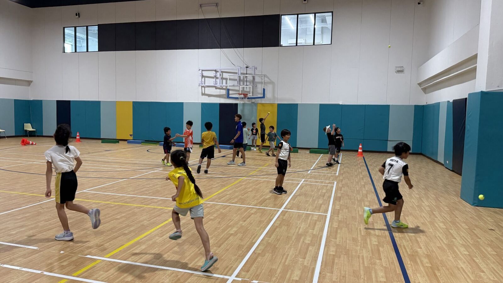 Children playing a team game in the gym